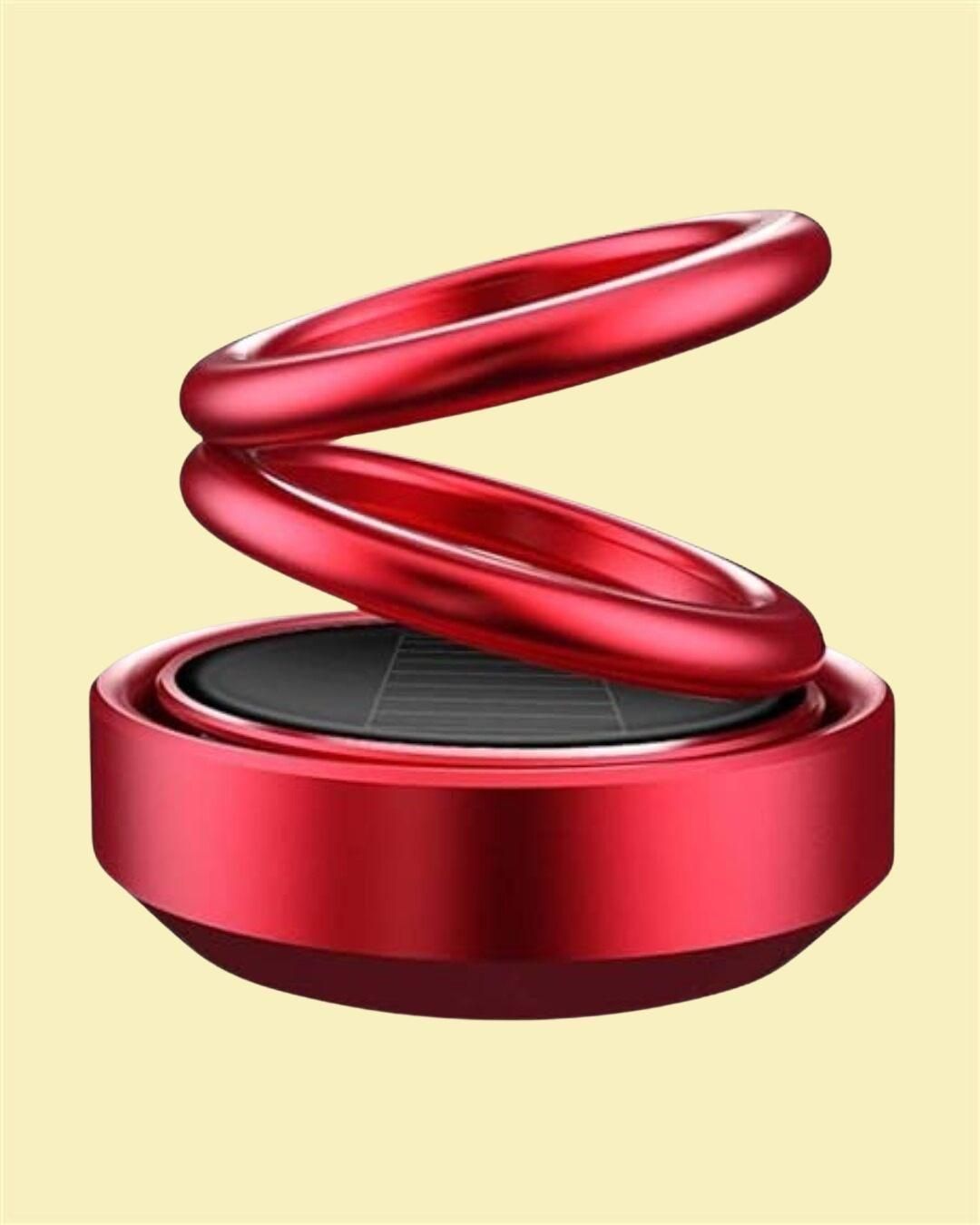 Red metal spring-like object on a beige background