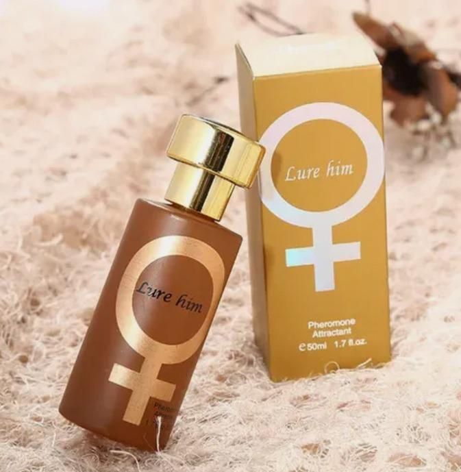 Perfume bottle and packaging labeled 'Lure him' on a textured surface