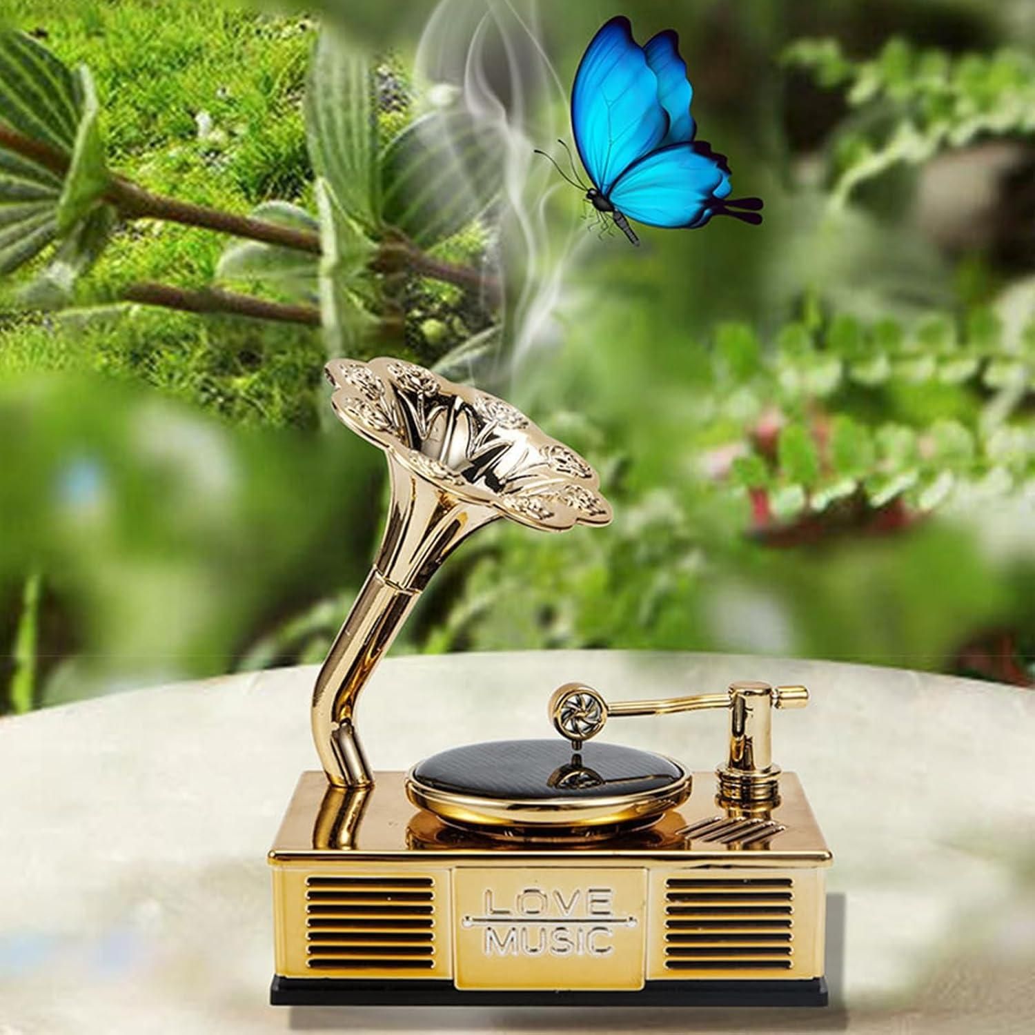 Decorative music box with butterfly design on a natural background